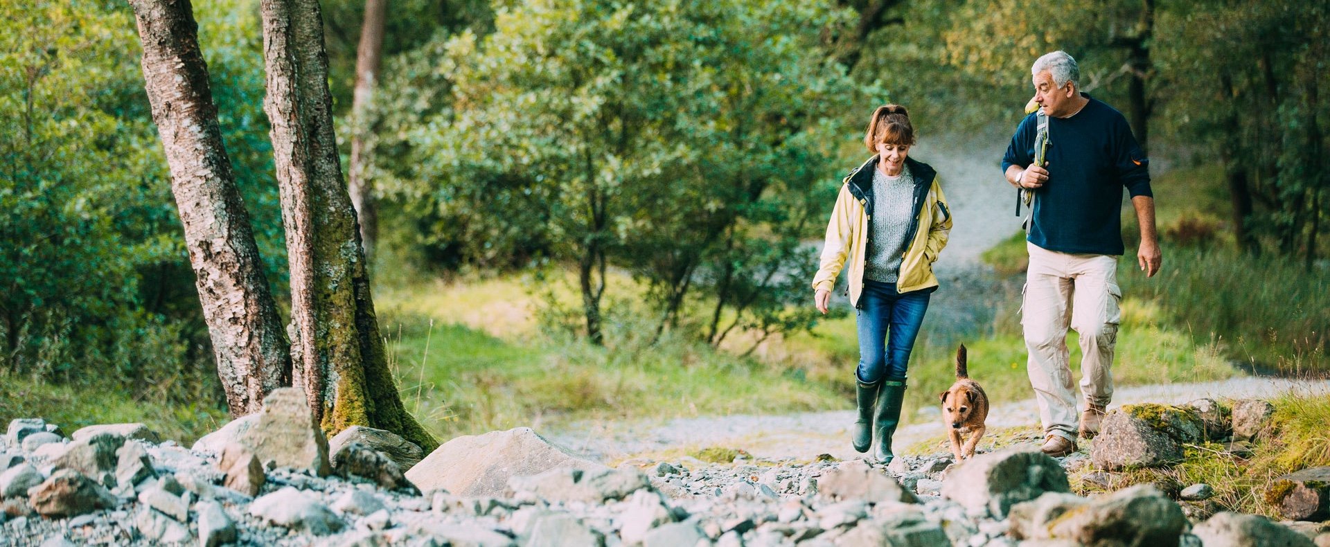 couple-hiking-with-dog